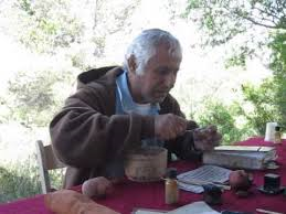 THe scribe Zechariya making kosher ink in Neot Kedumim from locally grown plants